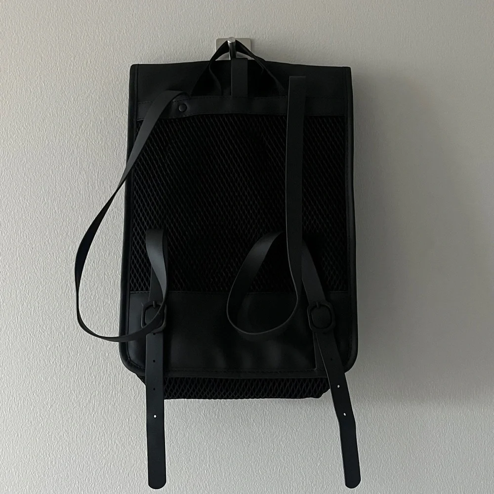 Rains Black Mesh Roll top Backpack